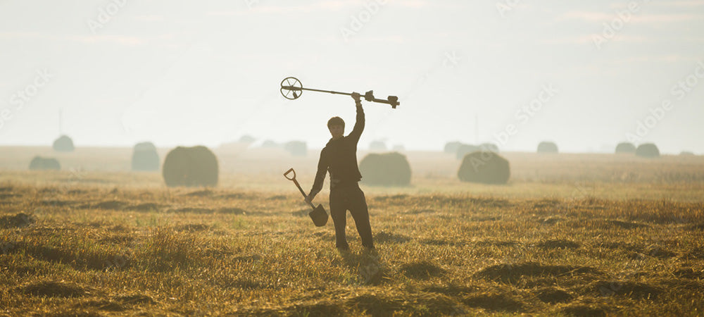 The Art of Metal Detecting. Metal Detectorist in field