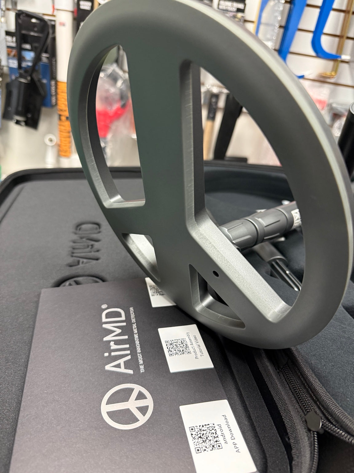 Close-up of AirMD metal detector search coil and documentation