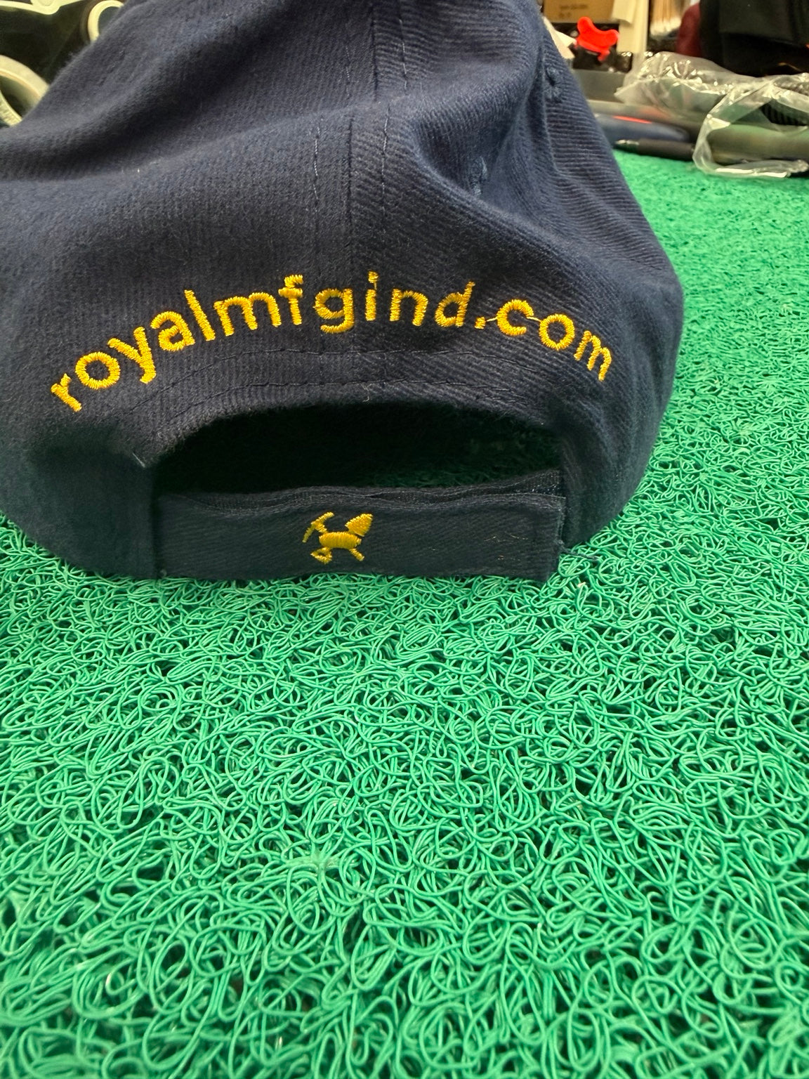 Royal Manufacturing navy hat back with royalmfgind.com embroidery