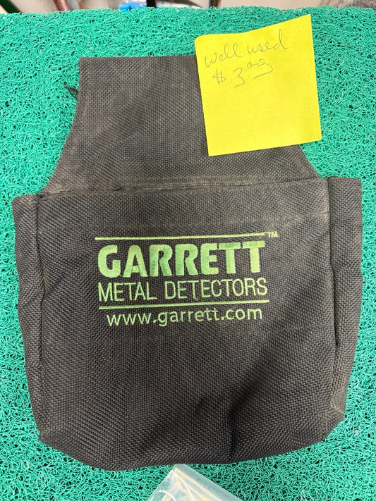 Well used Garrett Metal Detectors black finds pouch
