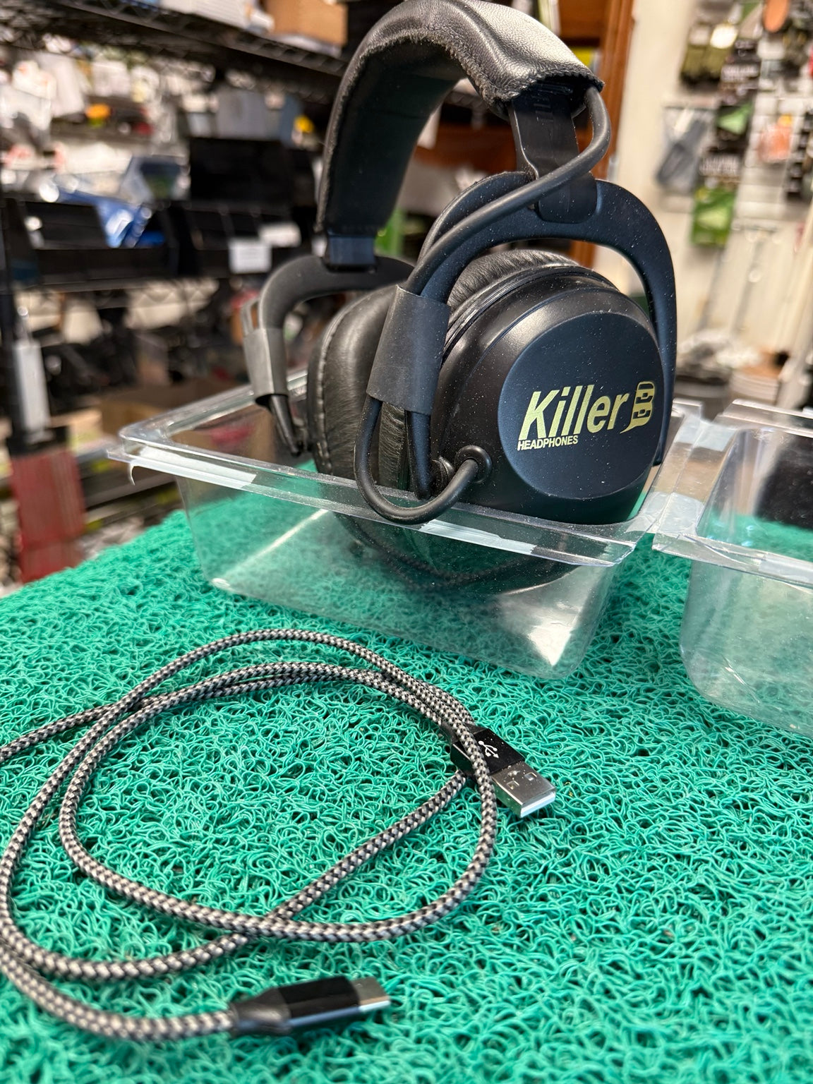 Actual used Killer B wireless headphones with included charging cable