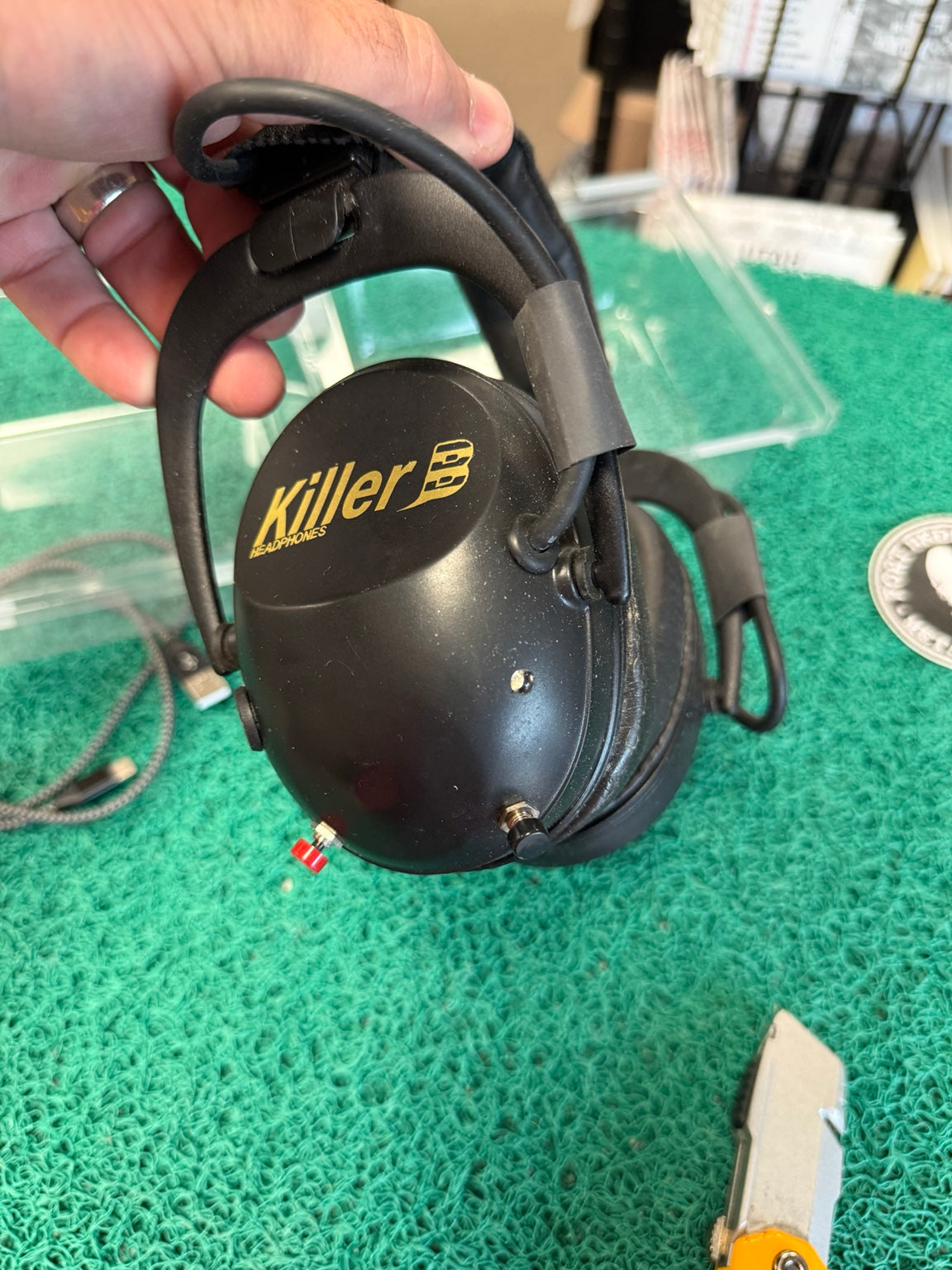 Actual Killer B wireless headphones showing controls